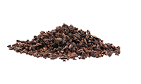 Pile cocoa nibs. Starting ingredient to make homemade chocolate.